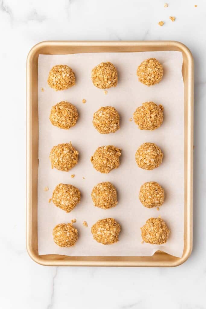3 Ingredient Peanut Butter Oatmeal Balls on a baking sheet