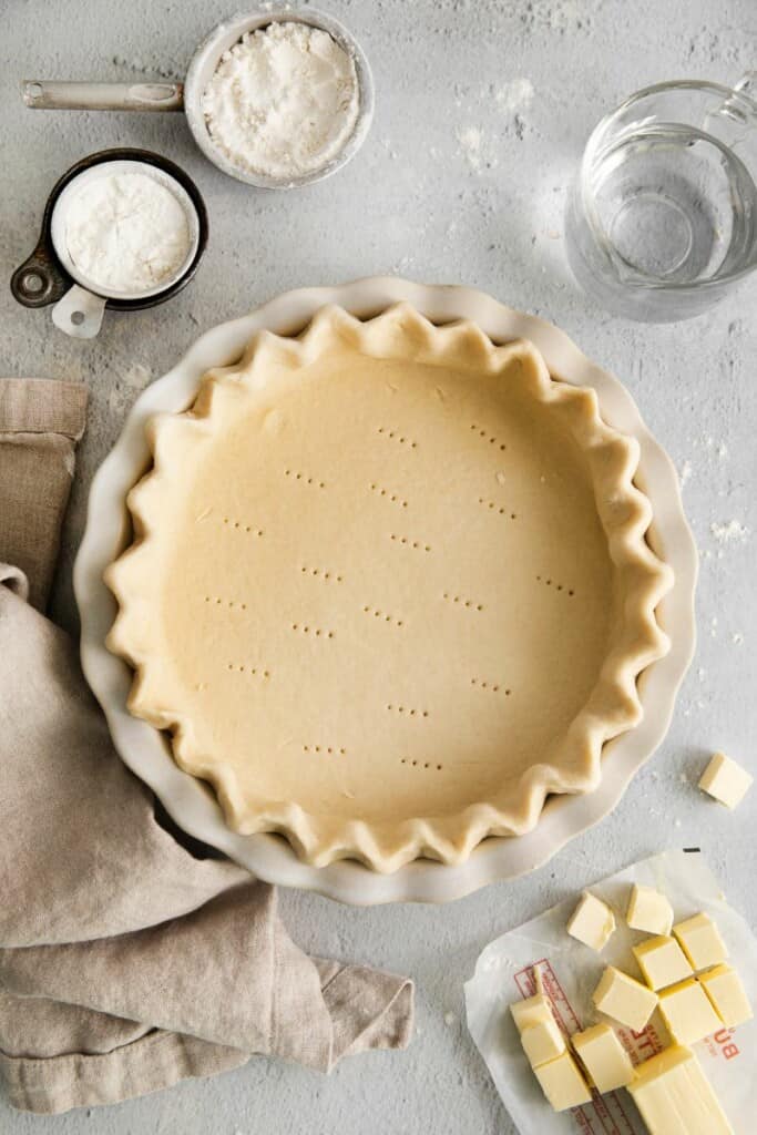 pie crust in pan with decorative edges