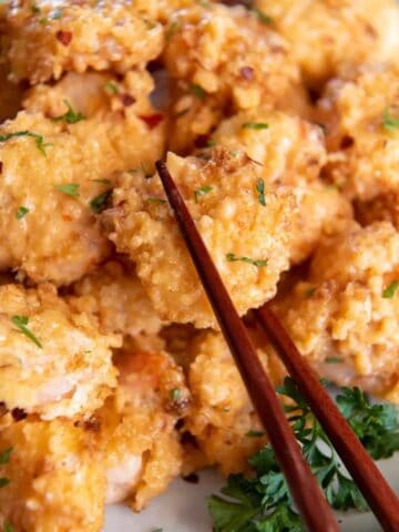 chopsticks picking up bang bang shrimp