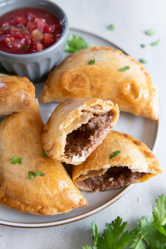 empanada in half with filling visible