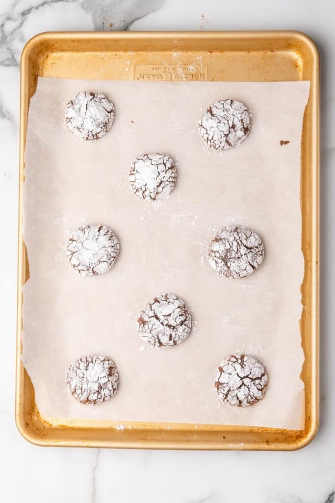 crinkle brownie cookies on baking sheet