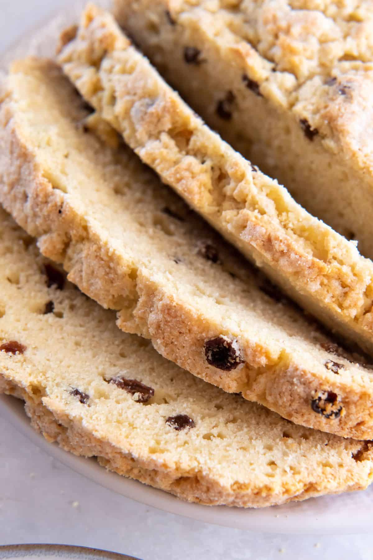 Irish soda bread without buttermilk close up cut in slices.