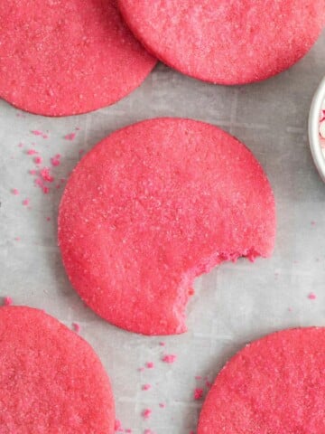 pink sugar cookies with bite out of it
