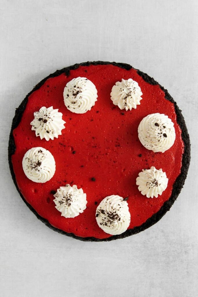 Red Velvet Oreo Cheesecake with dollops of whipped cream