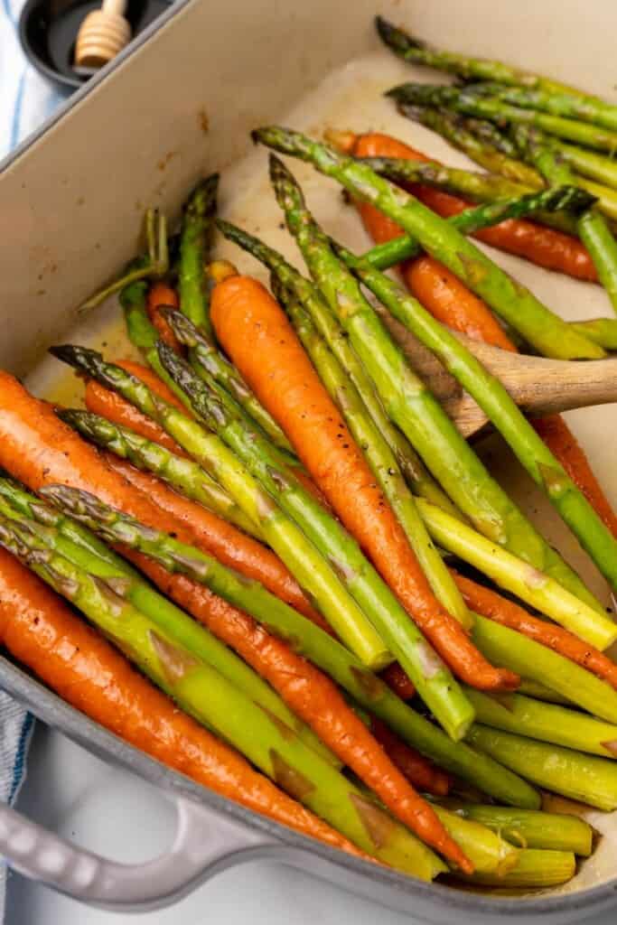 casserole dish with carrots and asparagus