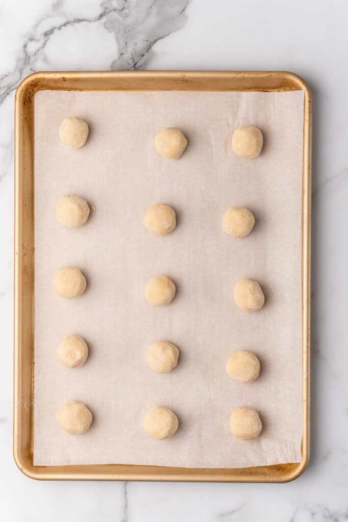 unbaked cookie dough on a baking sheet