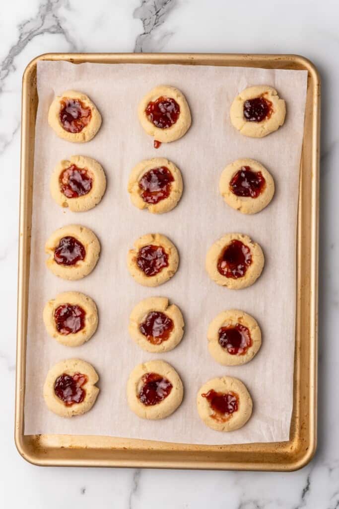 jam cookies on a baking sheet