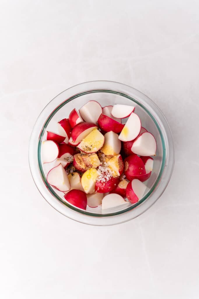 radishes in bowl with seasonings