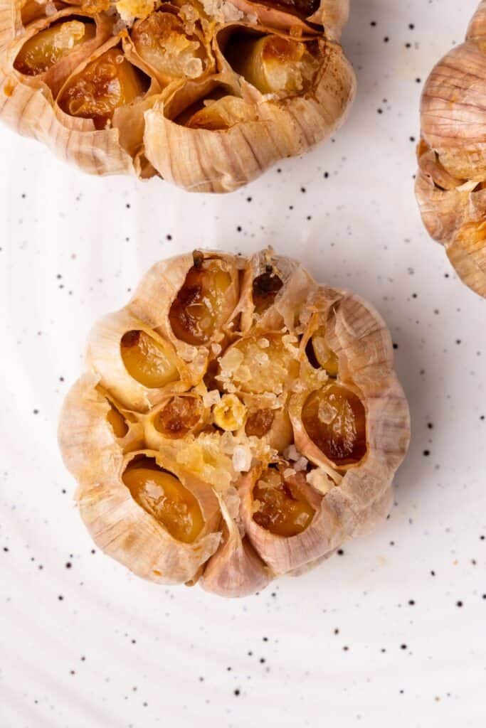 Overhead shot of air fryer roasted garlic to show the entire bulb of garlic.