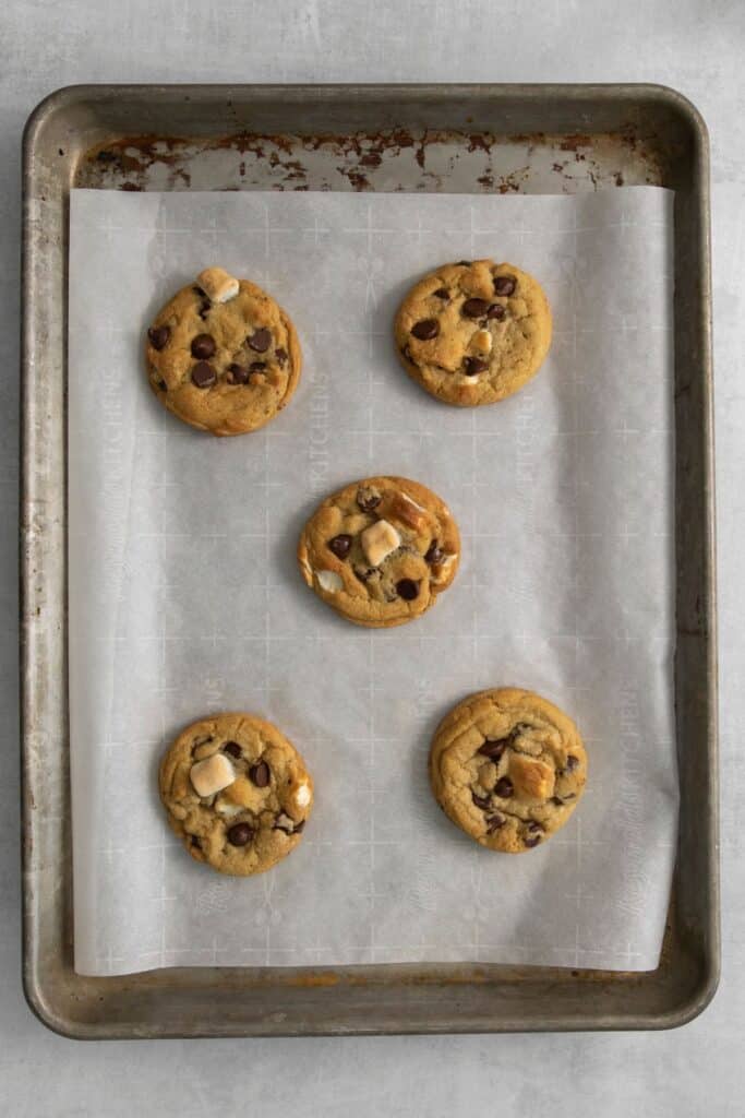 Baked marshmallow cookies on a baking sheet with parchment paper.