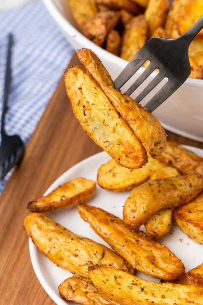 fork with a couple of potatoes
