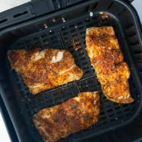 air fryer with cooked haddock
