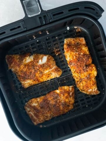 air fryer with cooked haddock