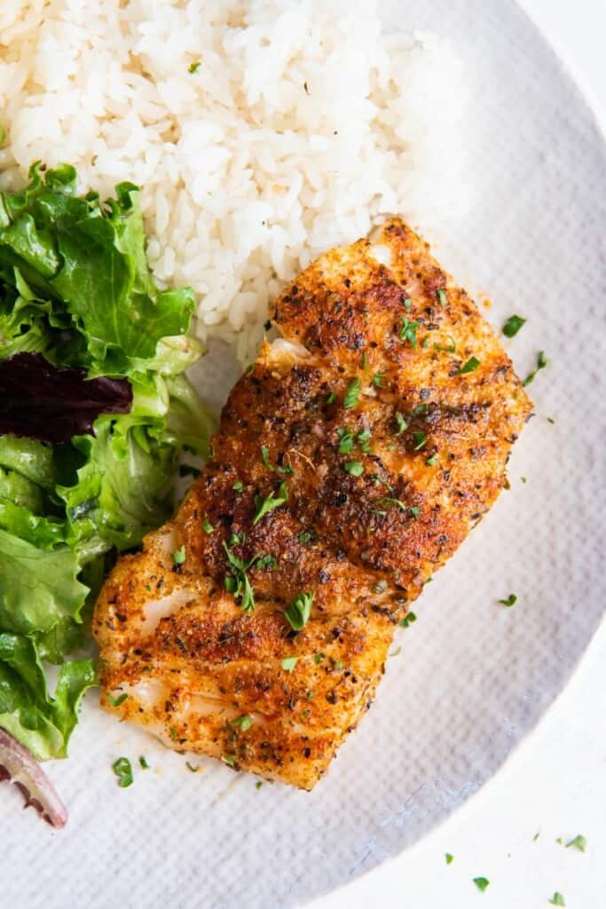 haddock on a plate with rice