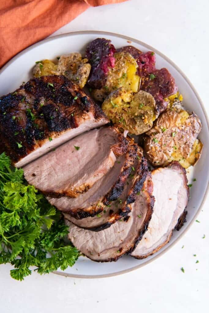 platter with pork roast and vegetables