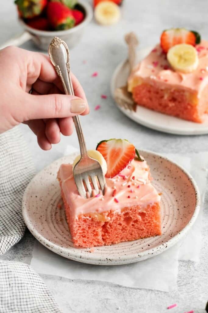 fork cutting piece of cake