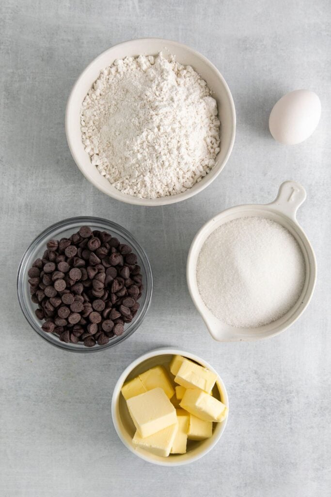 Ingredients to make my chocolate chip cookie recipe without brown sugar: butter, sugar, egg, self-rising flour, and chocolate chips.