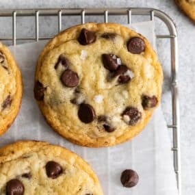 Close up of the chocolate chip cookie recipe without brown sugar on a wire rack.