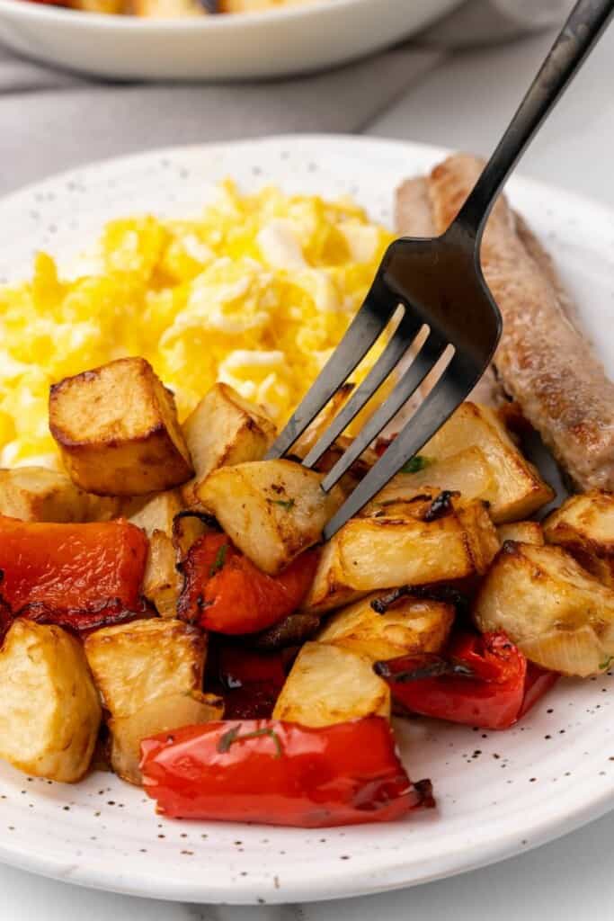 plate with eggs, sausage and breakfast potatoes
