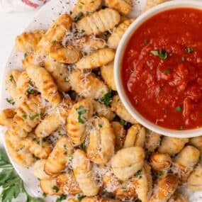 gnocci on platter with sauce