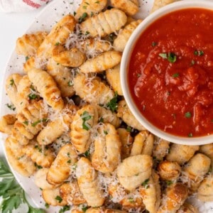 gnocci on platter with sauce