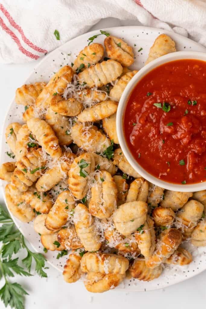 gnocci on platter with sauce