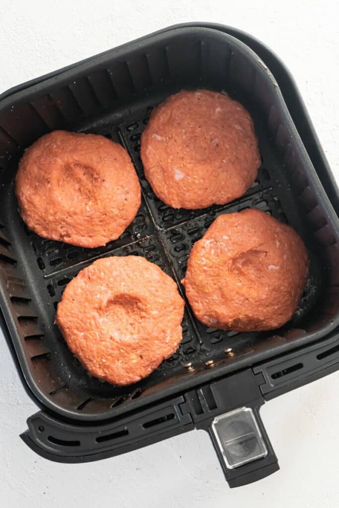 turkey burgers in an air fryer basket
