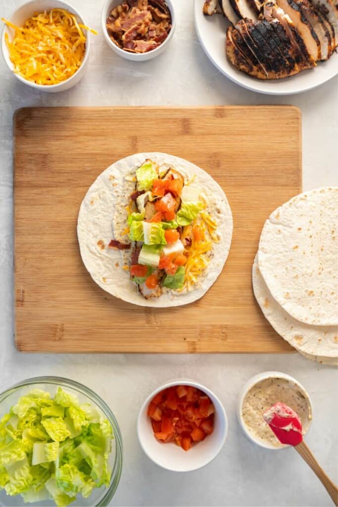 tortillas with fillings on cutting board