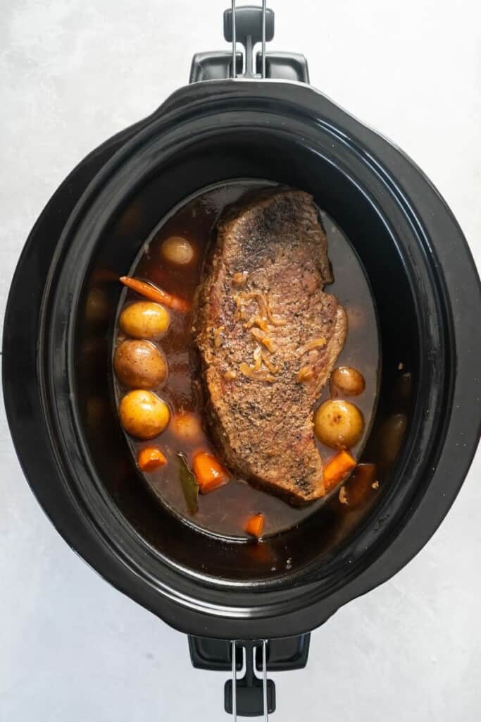 crockpot with london broil and potatoes