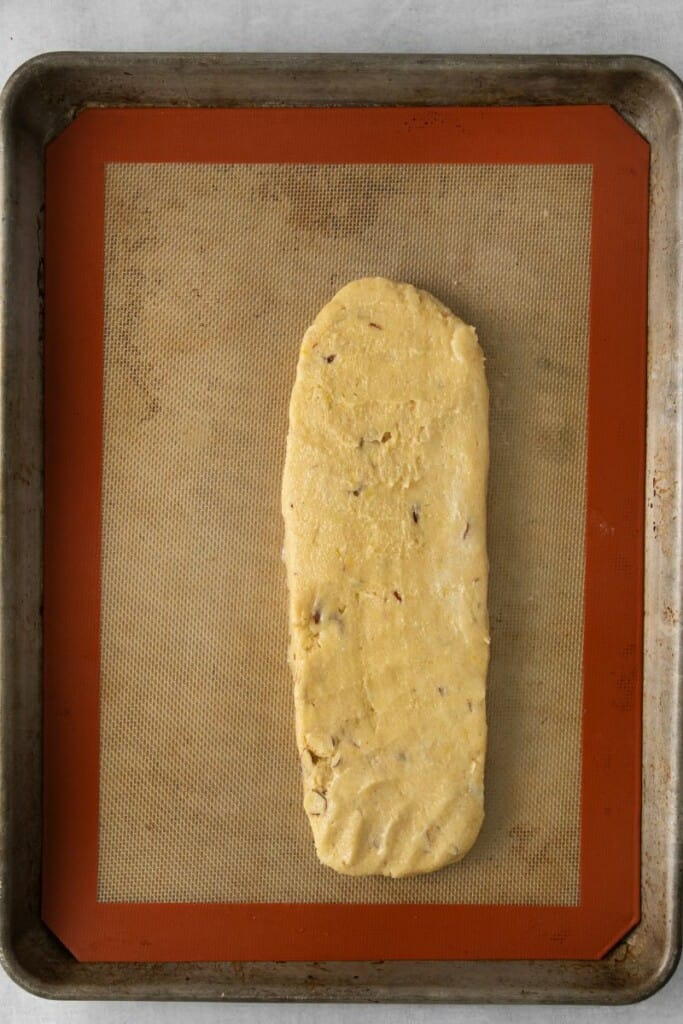 rolling out lemon biscotti