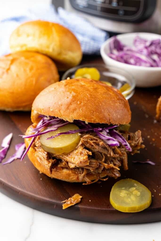 bun with pulled pork and toppings