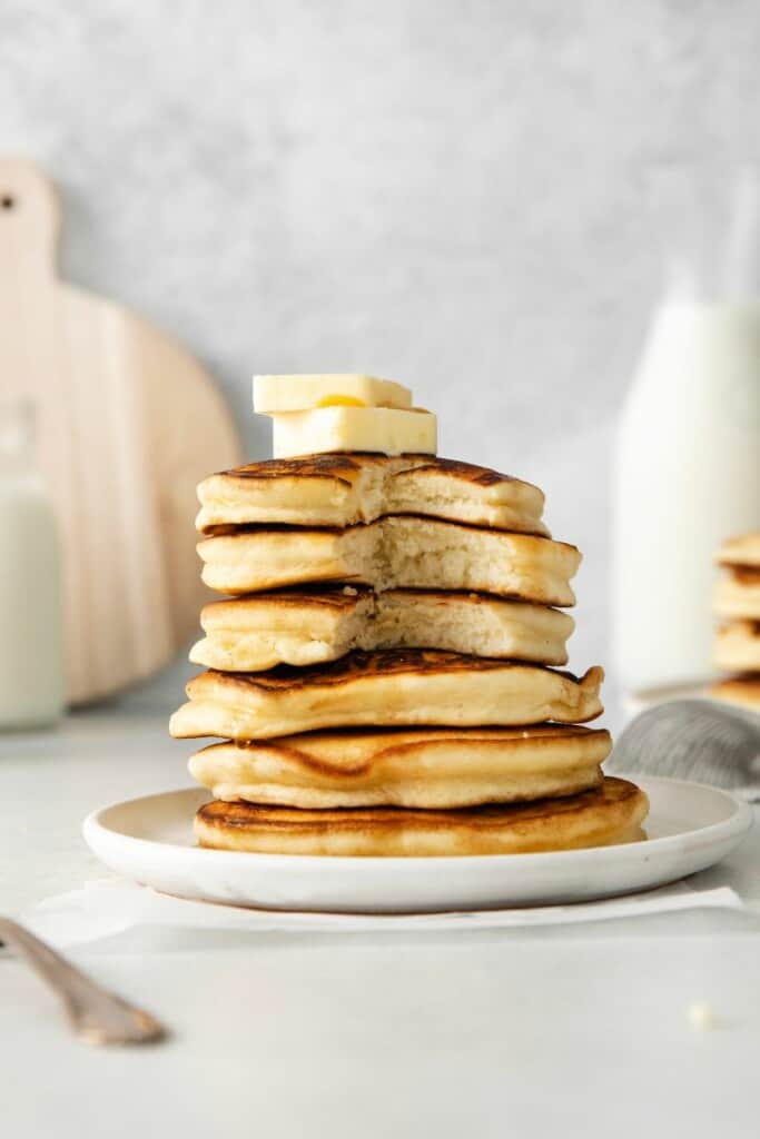 stack of pancakes with butter on top