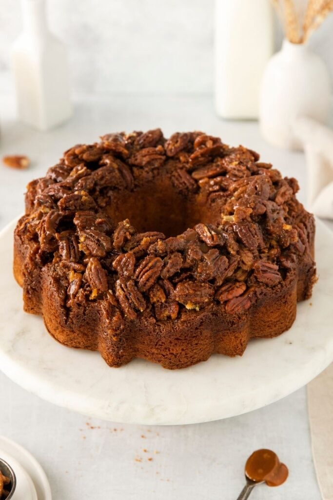 Baked pecan upside down cake on a serving platter.