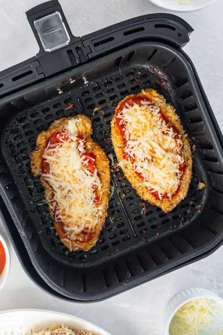 air fryer with melted cheese on chicken parmesan