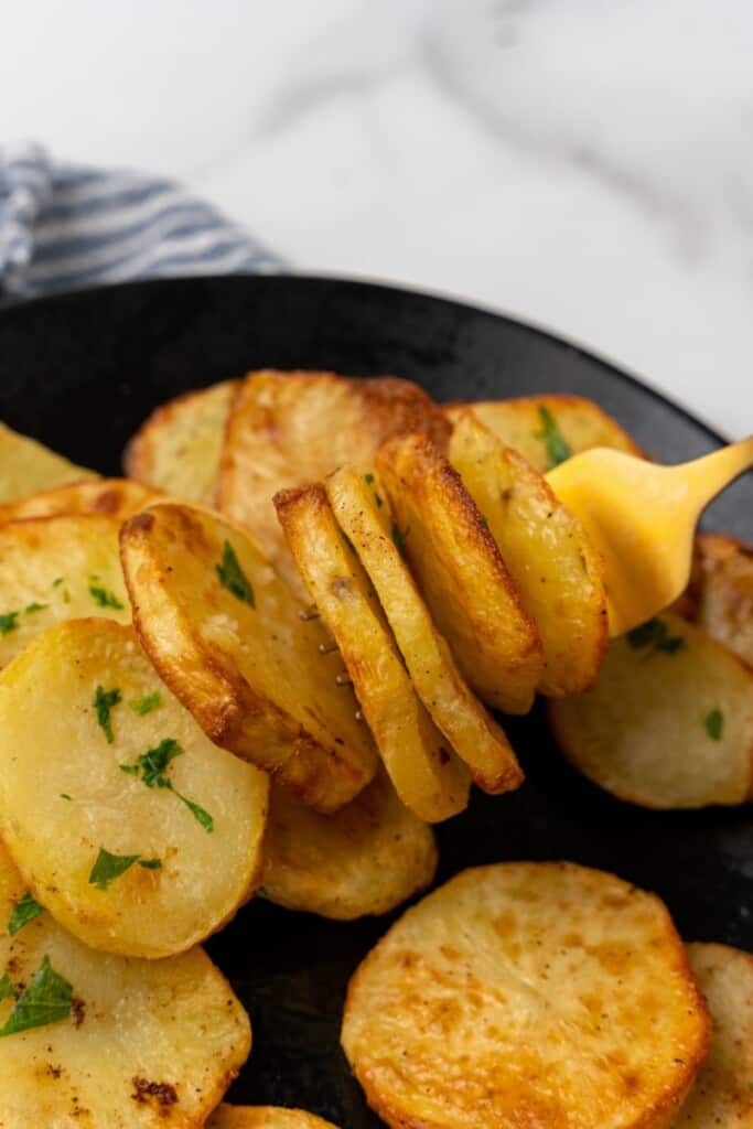 fork with potato slices