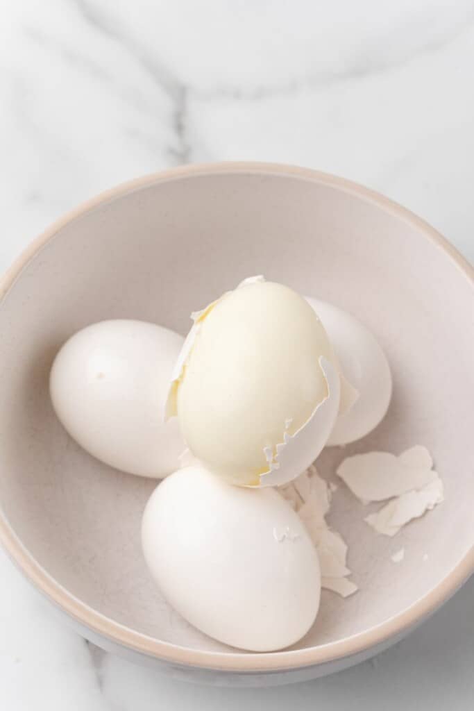 peeling soft boiled egg