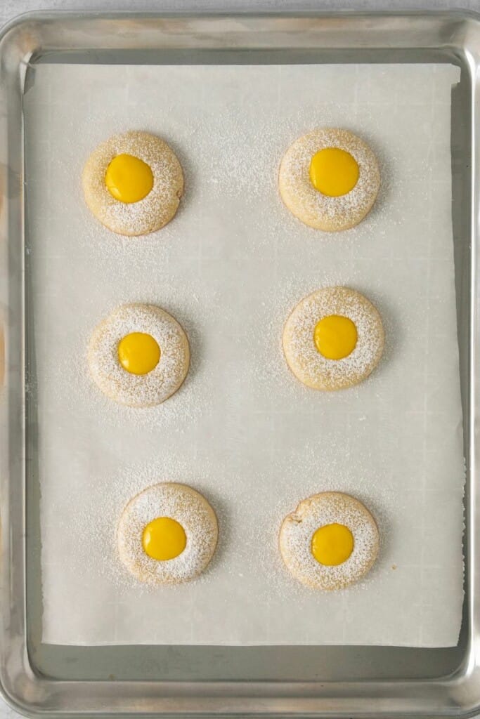 lemon curd cookies on a baking sheet