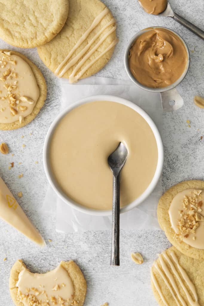 spoon dipped in peanut butter icing