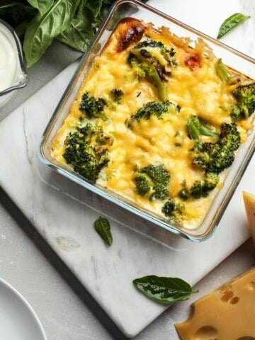 Broccoli and cheese in a glass dish that was cooked in the air fryer