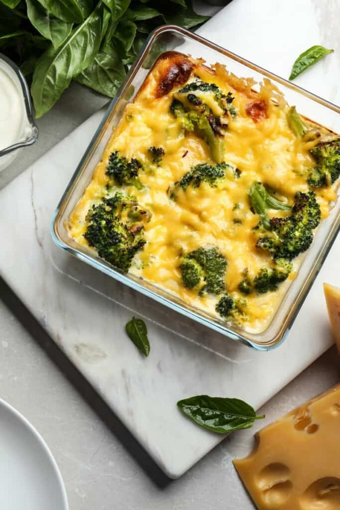 Broccoli and cheese in a glass dish that was cooked in the air fryer