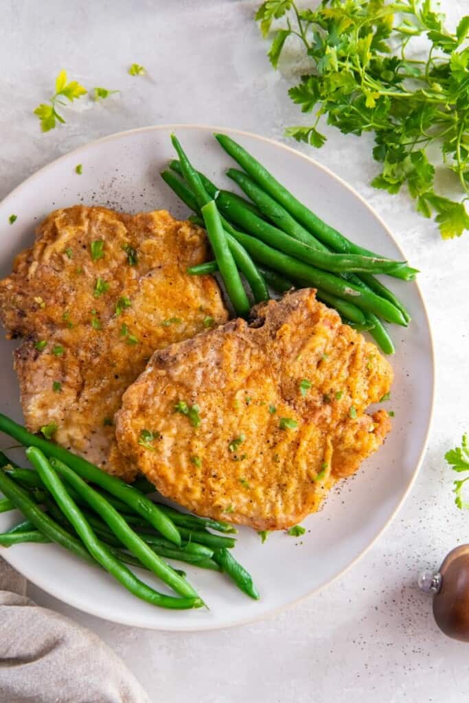 plate with pork chops and green beans