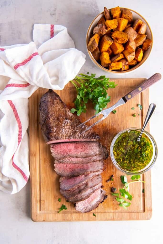 sliced tri tip on a cutting board