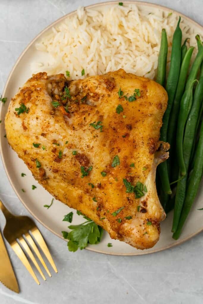 plate with baked chicken breast and green beans