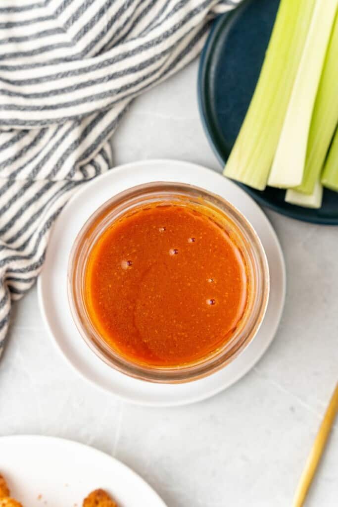 overhead shot of mild buffalo wing sauce