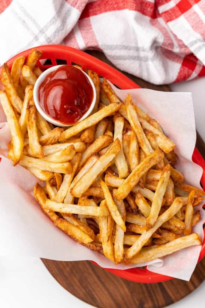 basket of french fries and ketchup