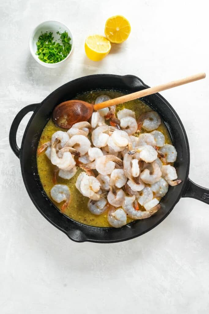 raw shrimp in skillet