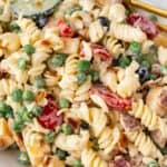 Closeup to see the pasta salad with bacon and ranch in a serving bowl.