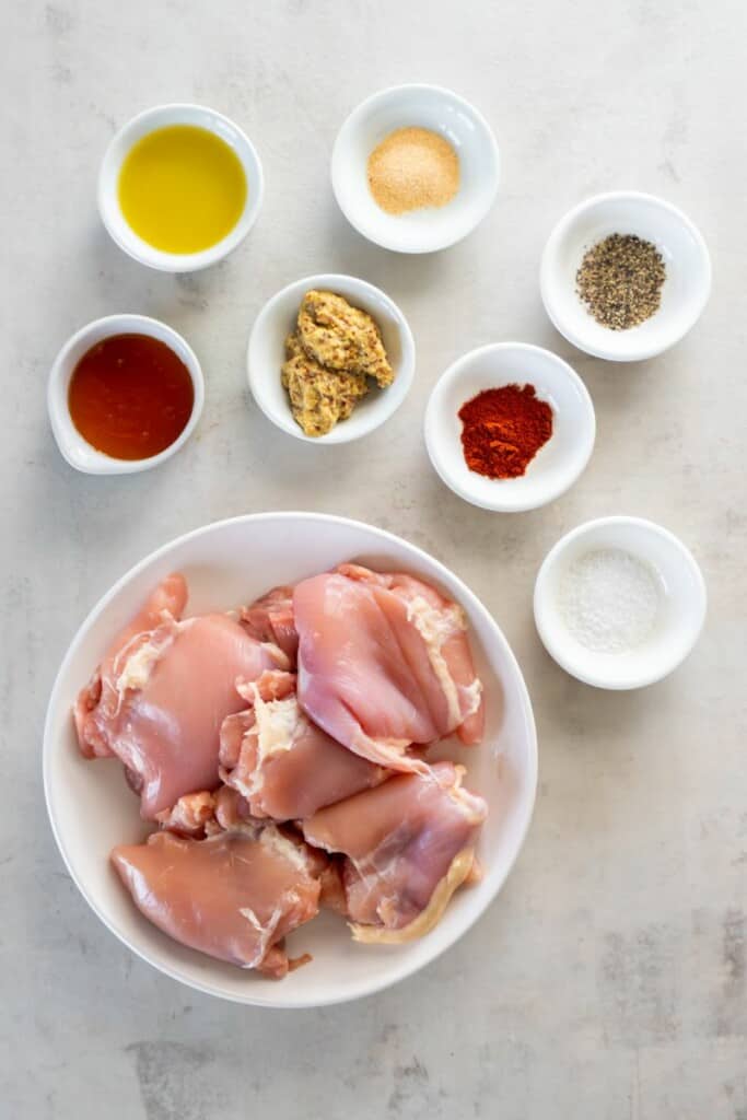 Overhead view of ingredients needed to prepare air fryer boneless chicken thighs.