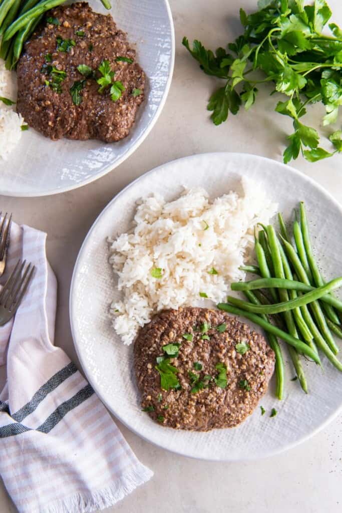 Air Fryer Cube Steak soaks in a delicious marinade and has a moist, tender bite. Serve this savory steak for a quick, easy lunch or dinner!