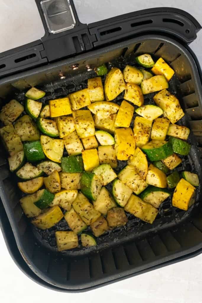 Overhead view of squash and zucchini prepared in the air fryer.